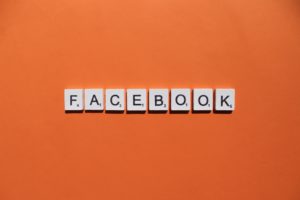 Facebook scrabble letters word on a orange background